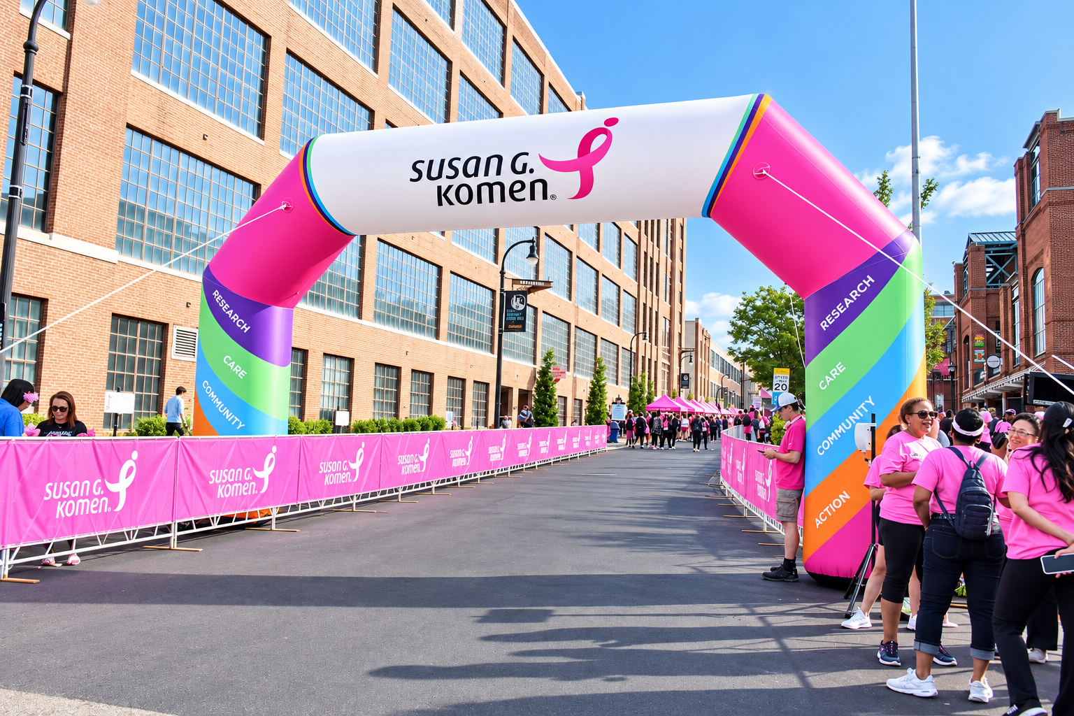 Susan G. Komen race arch with participants at the event