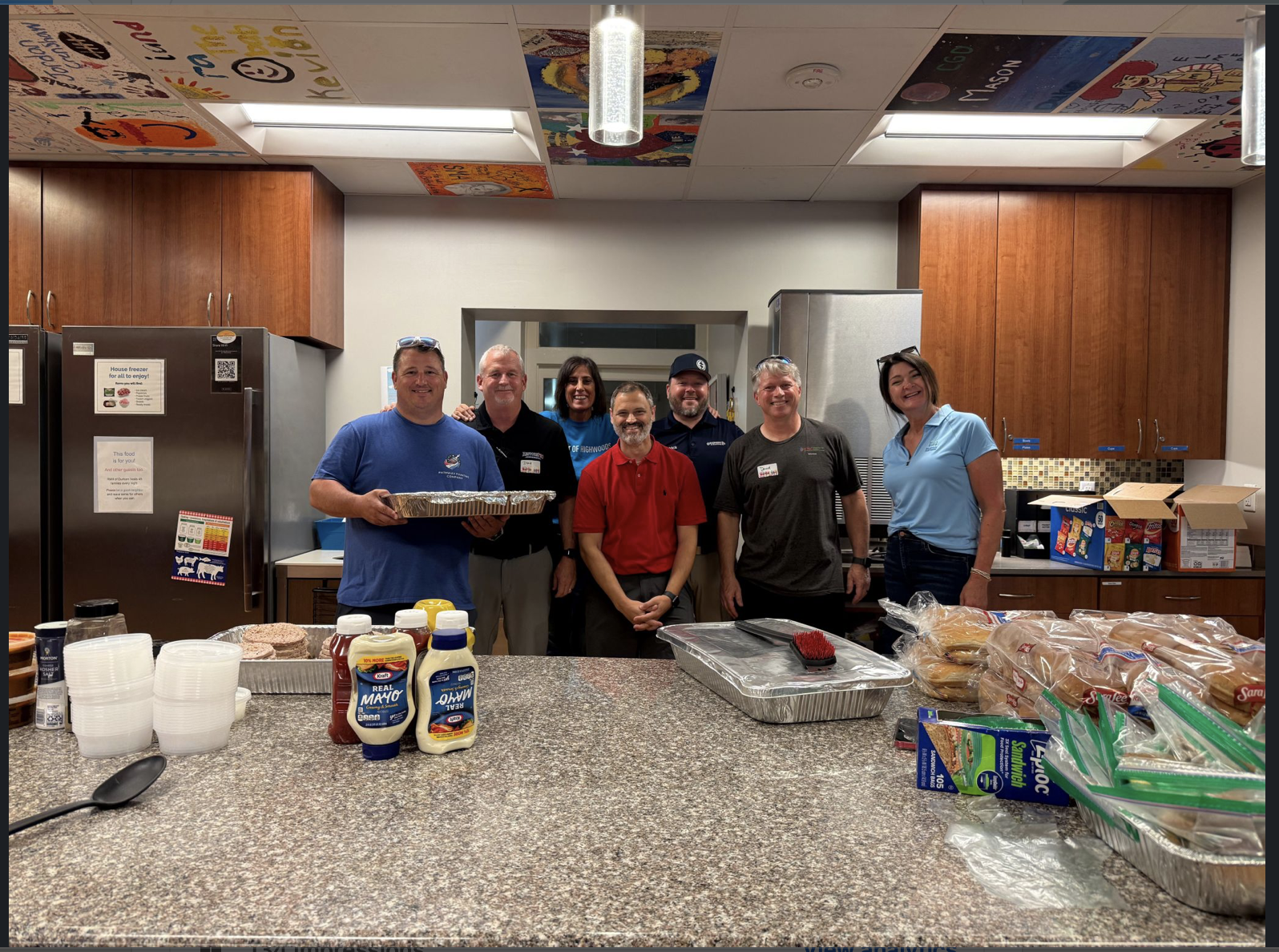Volunteers gathered in the Ronald McDonald House Durham kitchen